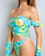 Lemon Drop rave top with off-shoulder ruffles and matching bottoms in bright turquoise citrus print