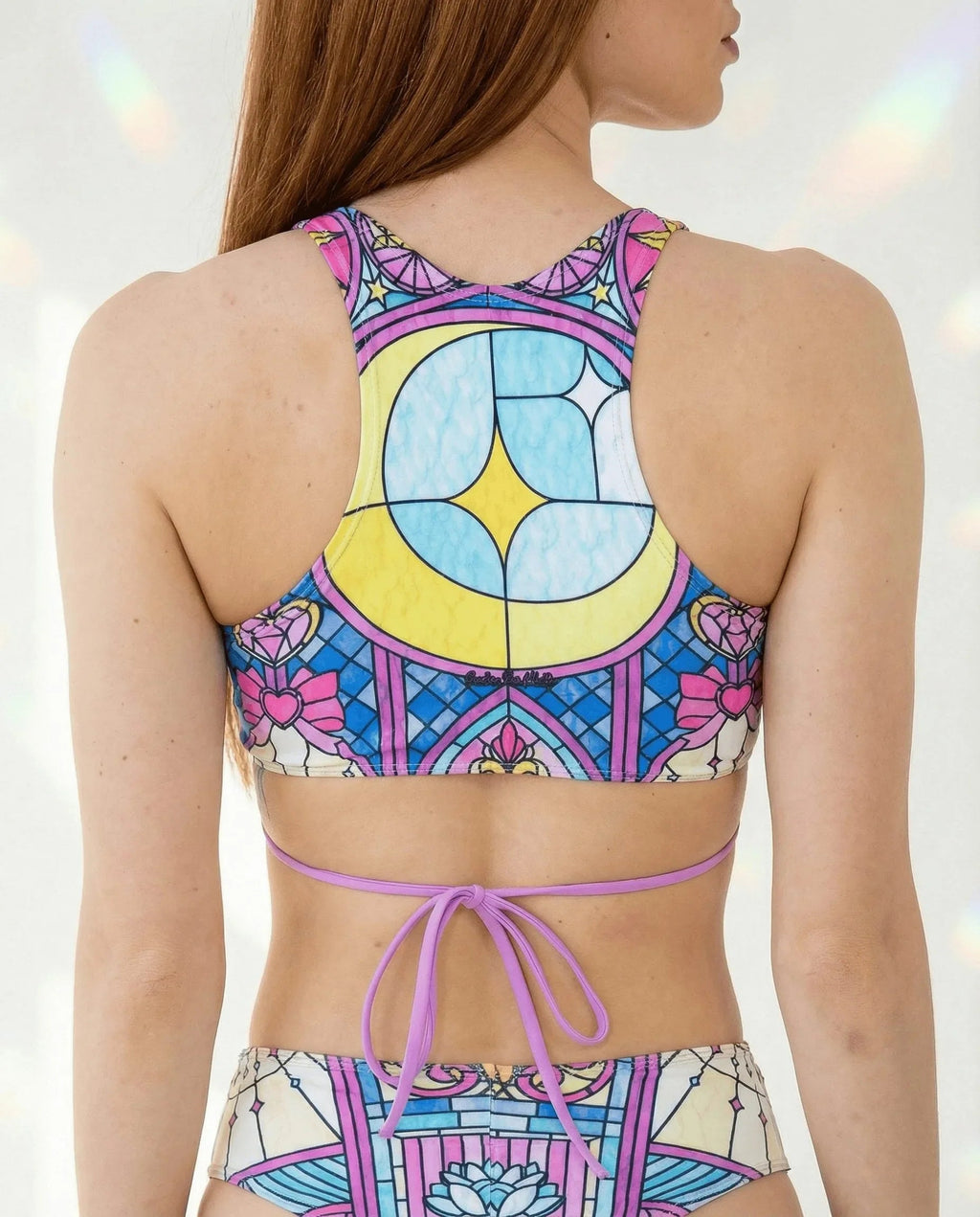 Moonlight Teaser Top with Straps shown from the back, featuring a pastel stained-glass rave design
