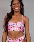 Pink cherry blossom rave top with matching bottoms modeled front view for festival outfit styling