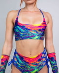 Saurian reversible rave top with matching bottoms and arm sleeves in vibrant neon tropical print, front view