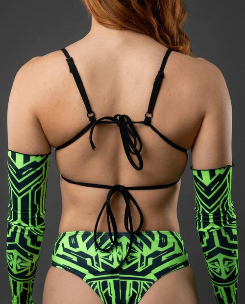 Techtronix Wonder Top shown from the back, featuring neon green circuit lines on black fabric, perfect for rave festivals.