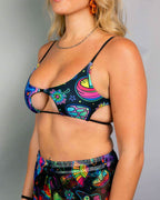 Vivid Shroomie Wonder rave top in psychedelic rainbow print with cutout straps, festival outfit front view