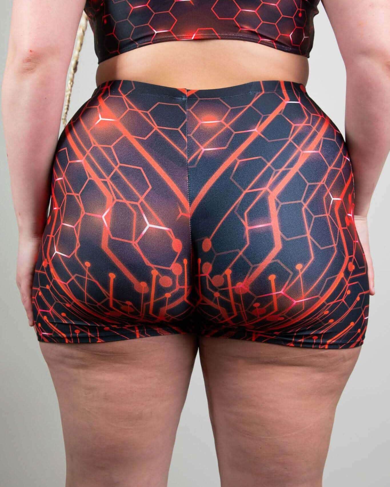 Red Singularity High Waist Shorts showcasing seamless design and bold pattern, ideal for rave outfits.