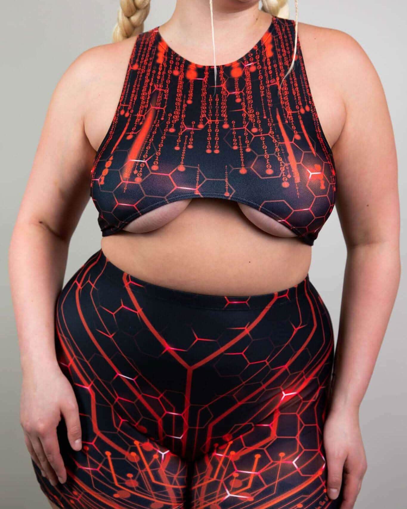 Model showcasing the Red Singularity Teaser Top and matching shorts, perfect for rave outfits with underboob exposure.