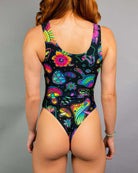 Colorful Shroomie Keyhole Bodysuit, featuring vibrant patterns, perfect for rave outfits. Detailed thong back design.