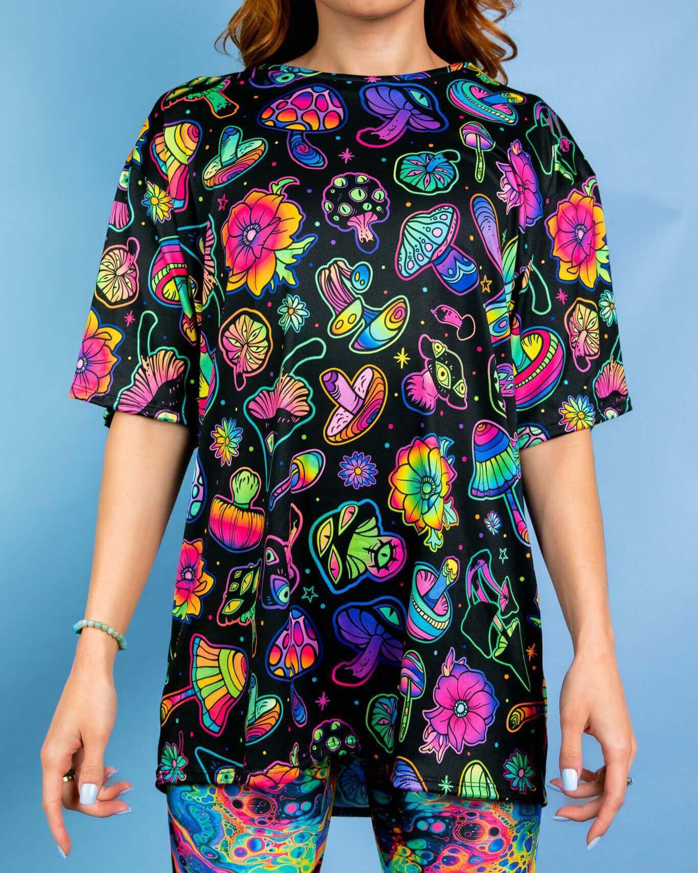 Oversized Shroomie tee with vibrant mushroom and floral print, perfect for rave outfits and ultimate comfort.
