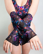 Model showcasing Starflora mesh flare sleeves with colorful floral design, perfect for rave outfits.