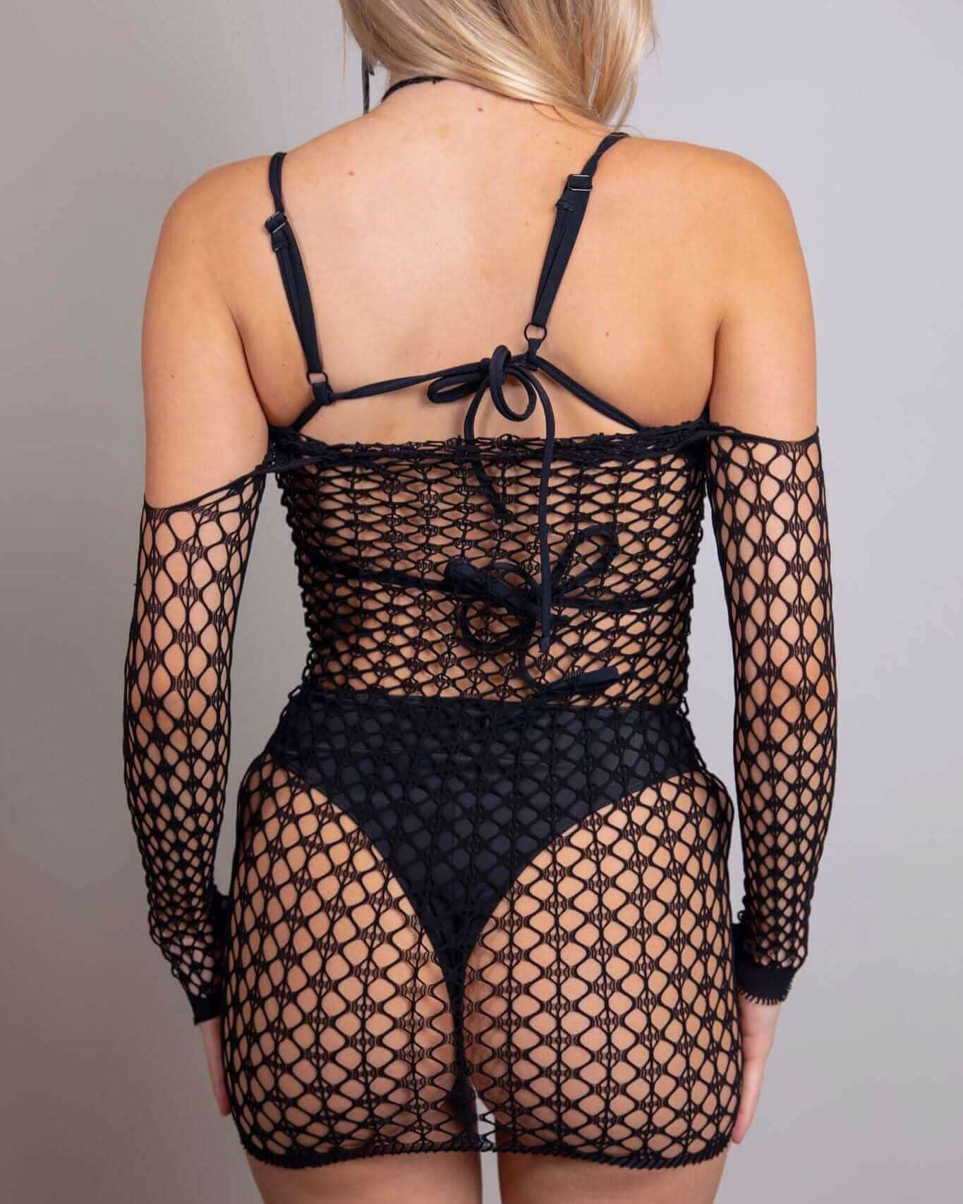 Back view of Tie It Up Halter Fishnet Dress, featuring sheer fishnet material and off-the-shoulder design, perfect for rave outfits.