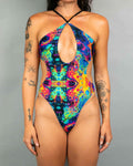 Vivid Halo Bodysuit with high-hip cut and keyhole design, perfect for rave outfits and vibrant party looks.