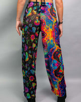 Brightly colored Vivid Shroomie Mesh Lucy Pants featuring rainbow patterns, perfect for raves and festivals.