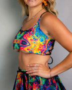 Vivid Shroomie psychedelic rainbow rave top with matching festival skirt front view on blonde model