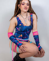 Model posing in the Wildwood Classic Bodysuit with matching sleeves, styled for a rave or festival look.