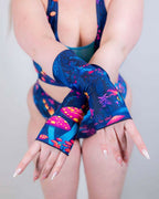 Wildwood rave arm sleeves in blue psychedelic mushroom print shown crossed front pose festival fashion