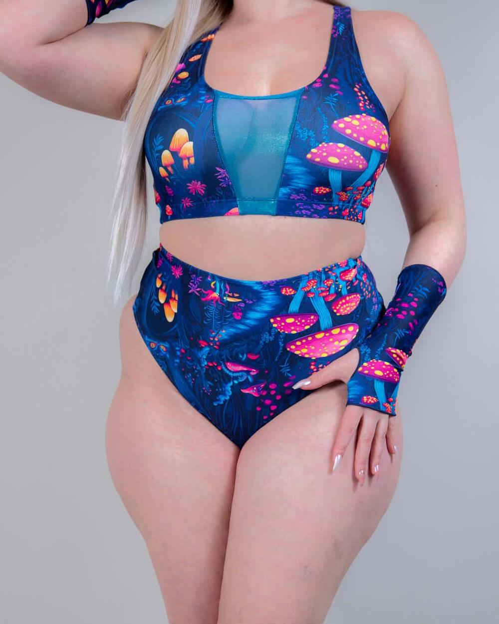 Front view of model posing in Wildwood High Waisted Bikini Bottoms, emphasizing the bold festival-inspired print.