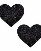 Black glitter heart-shaped pasties for rave outfits and bold fashion statements.
