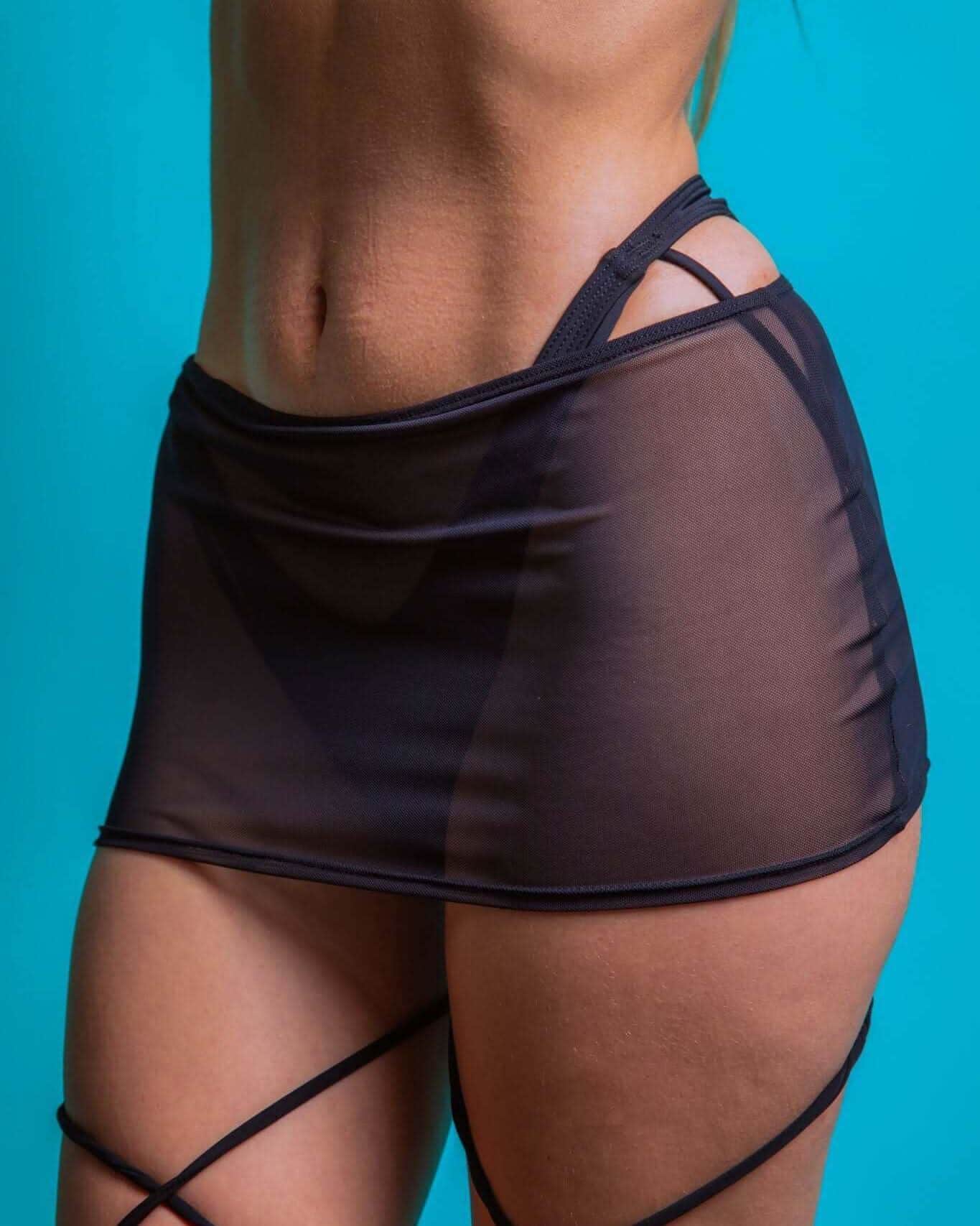 Black mesh extra mini skirt showcasing stylish coverage, perfect for rave outfits and all occasions.