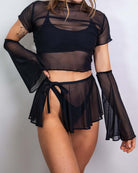 Matte black mesh flare sleeves paired with a cropped top and flowy skirt for stylish rave outfits.