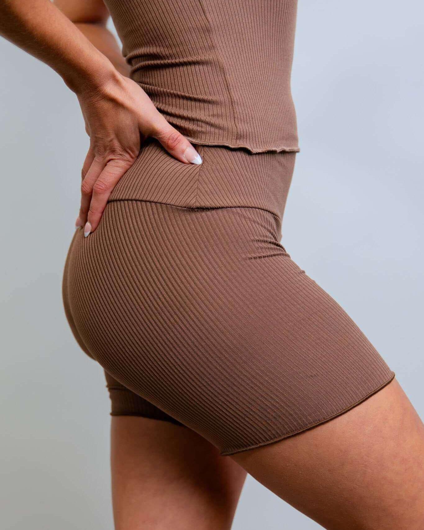 Model showcasing Brown Coco Ribbed Lounge Boxer Shorts, perfect for comfy rave outfits with soft ribbed fabric.