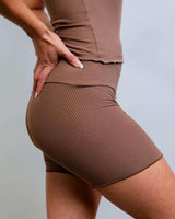 Model showcasing Brown Coco Ribbed Lounge Boxer Shorts, perfect for comfy rave outfits with soft ribbed fabric.