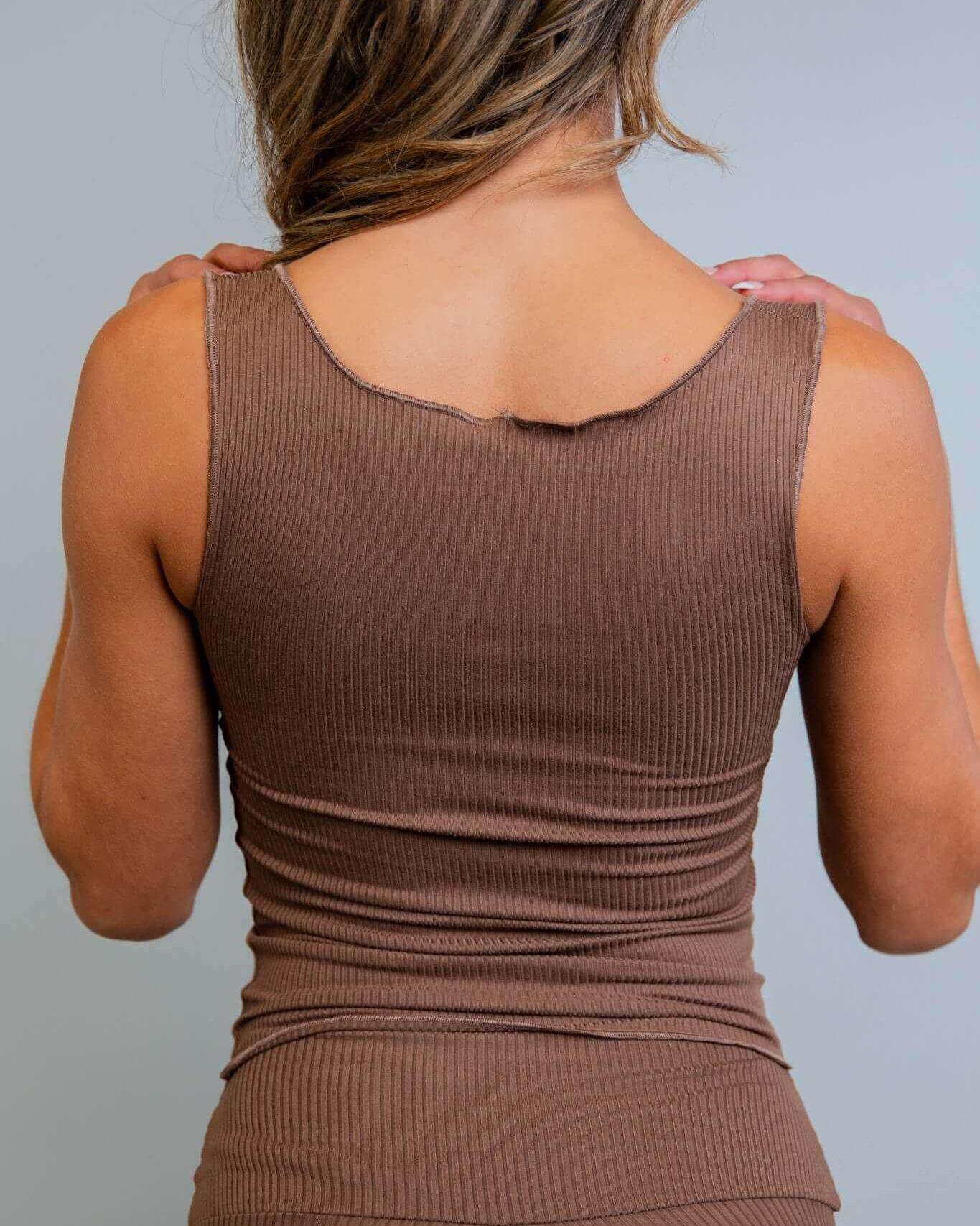 Back view of a woman wearing the Brown Coco Ribbed Lounge Tank in soft brown, ideal for cozy and stylish relaxation.