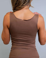 Back view of a woman wearing the Brown Coco Ribbed Lounge Tank in soft brown, ideal for cozy and stylish relaxation.