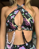 Black and colorful patterned chain top featuring a ring and unique designs, perfect for rave outfits and festivals.