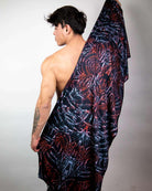Model showcasing the handmade Darkness Festival Scarf, styled for a rave outfit, emphasizing its soft, lightweight fabric.