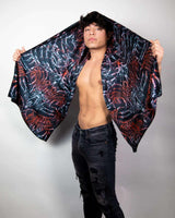 Model showcasing a handmade Darkness festival scarf, adding flair to festival outfits with a bold design.