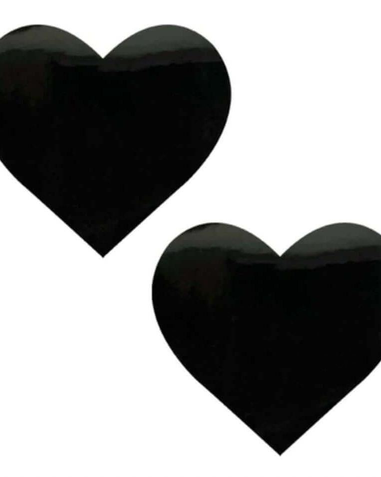 Pair of black heart-shaped vinyl nipple cover pasties for rave outfits and bold fashion statements.