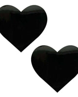 Pair of black heart-shaped vinyl nipple cover pasties for rave outfits and bold fashion statements.