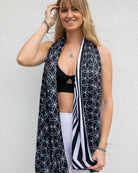 Model showcasing the Duality Festival Scarf with Flower of Life pattern and optical illusion, perfect for rave outfits.