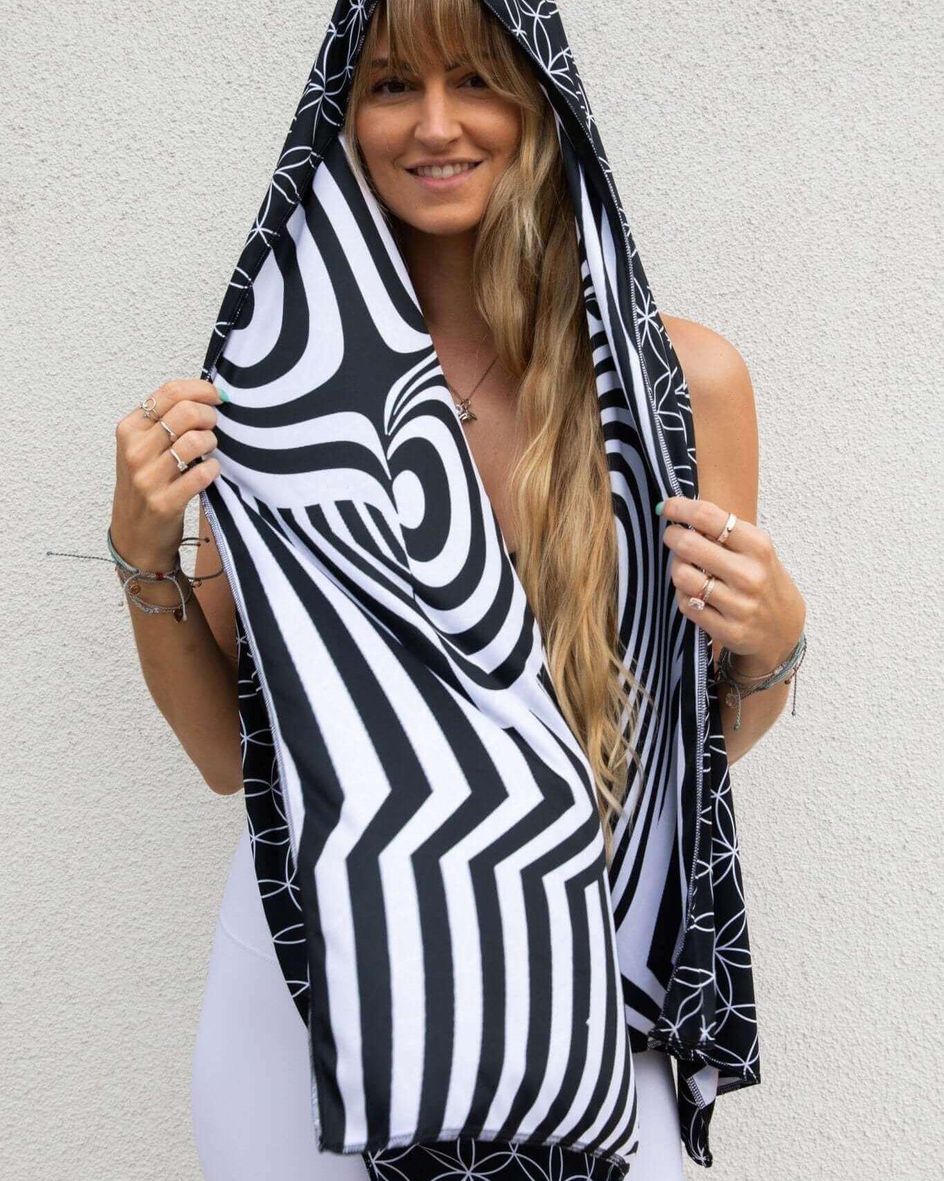Model showcasing the Duality Festival Scarf with Flower of Life and optical illusion patterns, perfect for rave outfits.