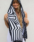 Model showcasing the Duality Festival Scarf with Flower of Life and optical illusion patterns, perfect for rave outfits.
