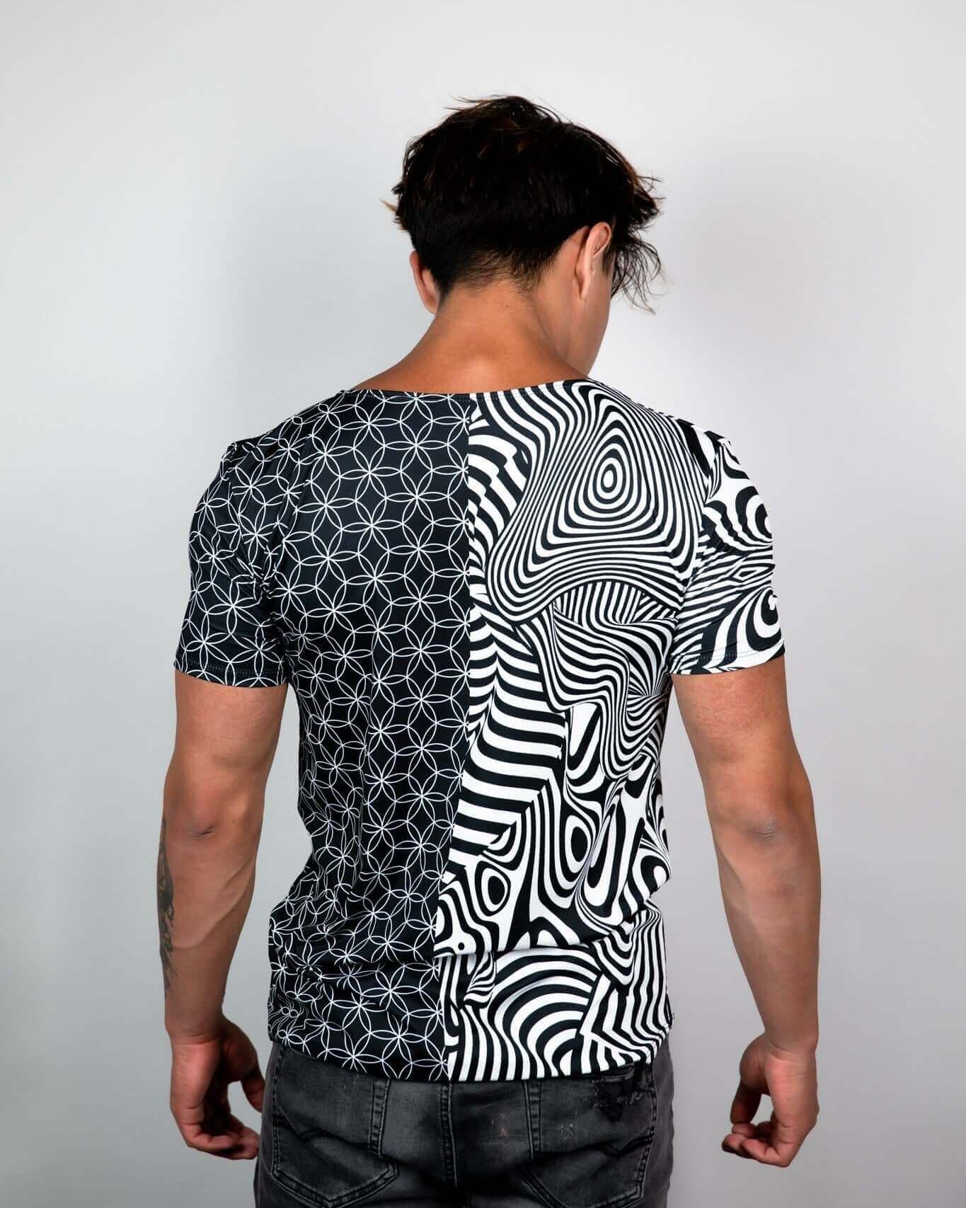 Duality Unisex T-Shirt showcasing black-and-white geometric patterns, perfect for rave outfits and sustainable fashion.