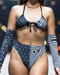Model showcasing the Duality Wrap Bikini Top with black and white graphic design, perfect for stylish beachwear and rave outfits.