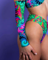 Vibrant Hypnotic Arm Sleeves paired with a colorful bikini, perfect for rave outfits and festival fashion.