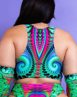 Colorful Hypnotic Teaser Top with racerback design, perfect for rave outfits, showcasing vibrant patterns and underboob style.