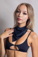 Model showcases a matte black bandana, perfect for rave outfits, adding a chic touch to festival attire.