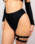 Matte black high-waisted Brazilian bottoms, perfect for rave outfits, featuring a cheeky cut and high hip design.