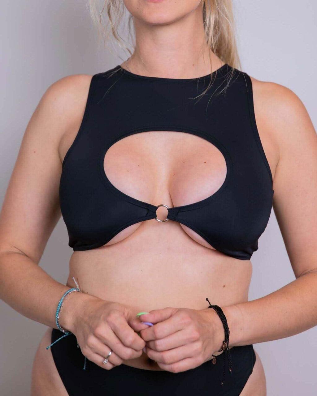 Matte black keyhole top with O-ring detail, perfect for rave outfits and night outings.