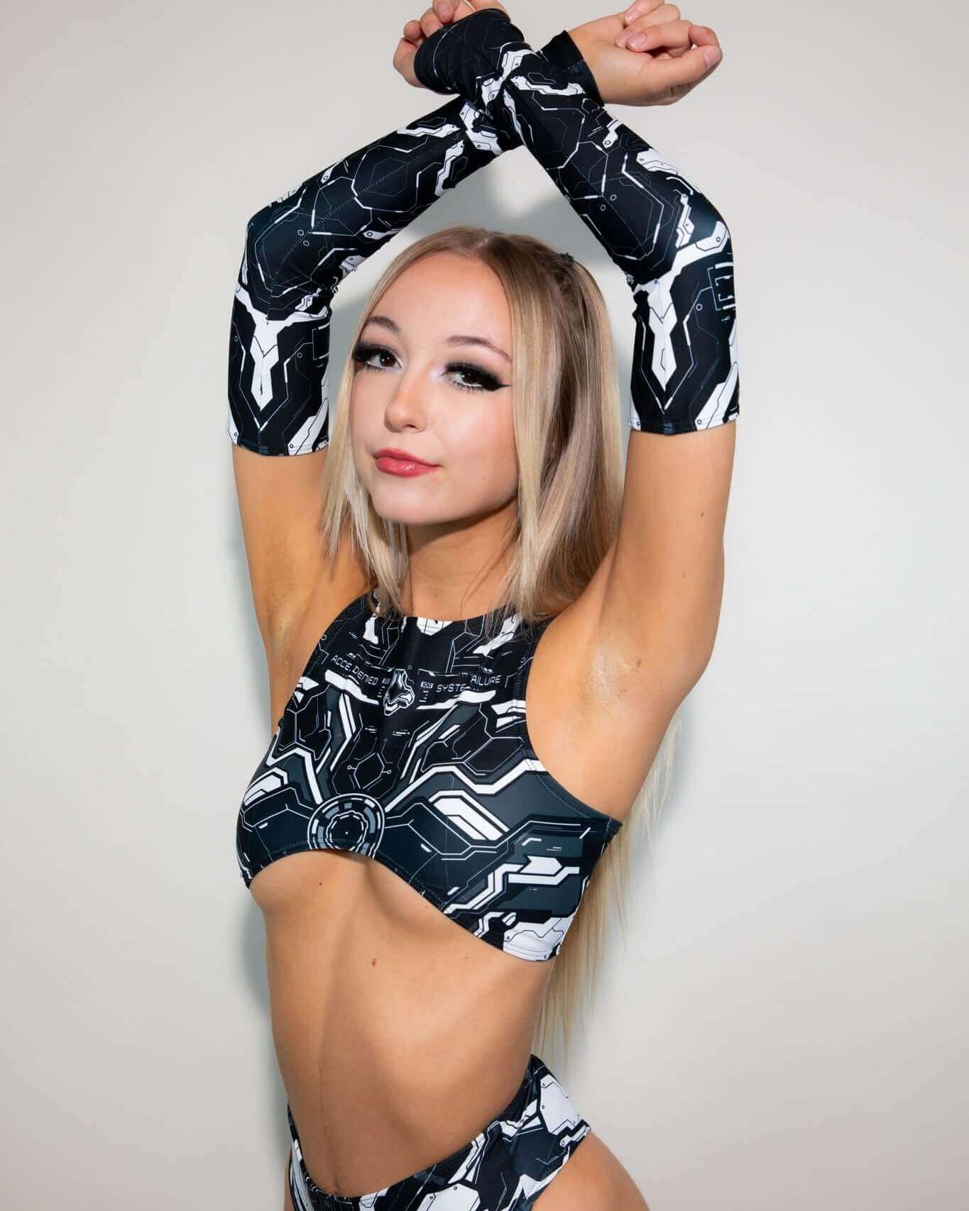 Model wearing Mechanoid Arm Sleeves - Black, showcasing a stylish rave outfit for a vibrant party look.