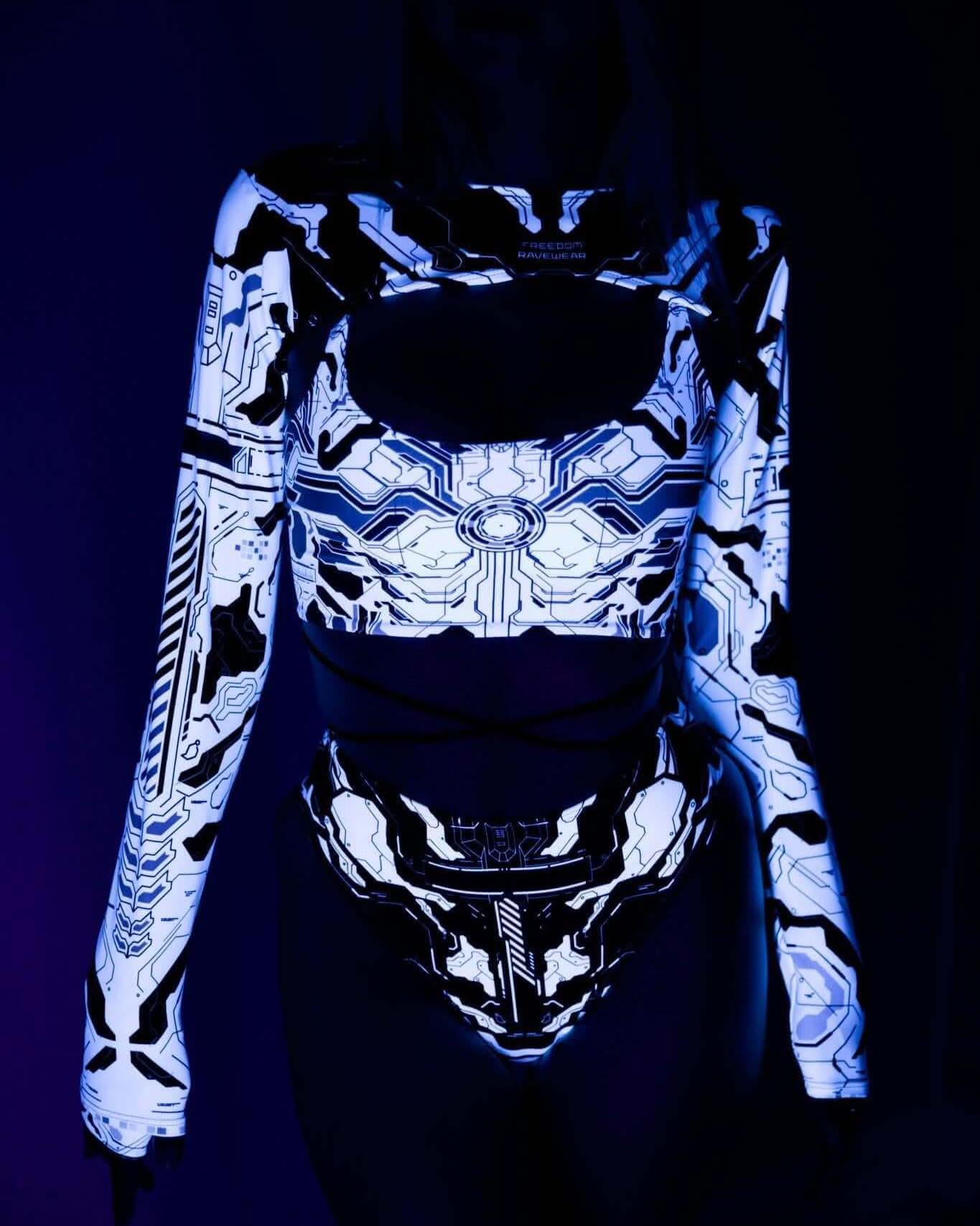 Woman wearing a neon Mechanoid rave outfit, featuring a glowing crop top and high-waisted thong, perfect for festivals.