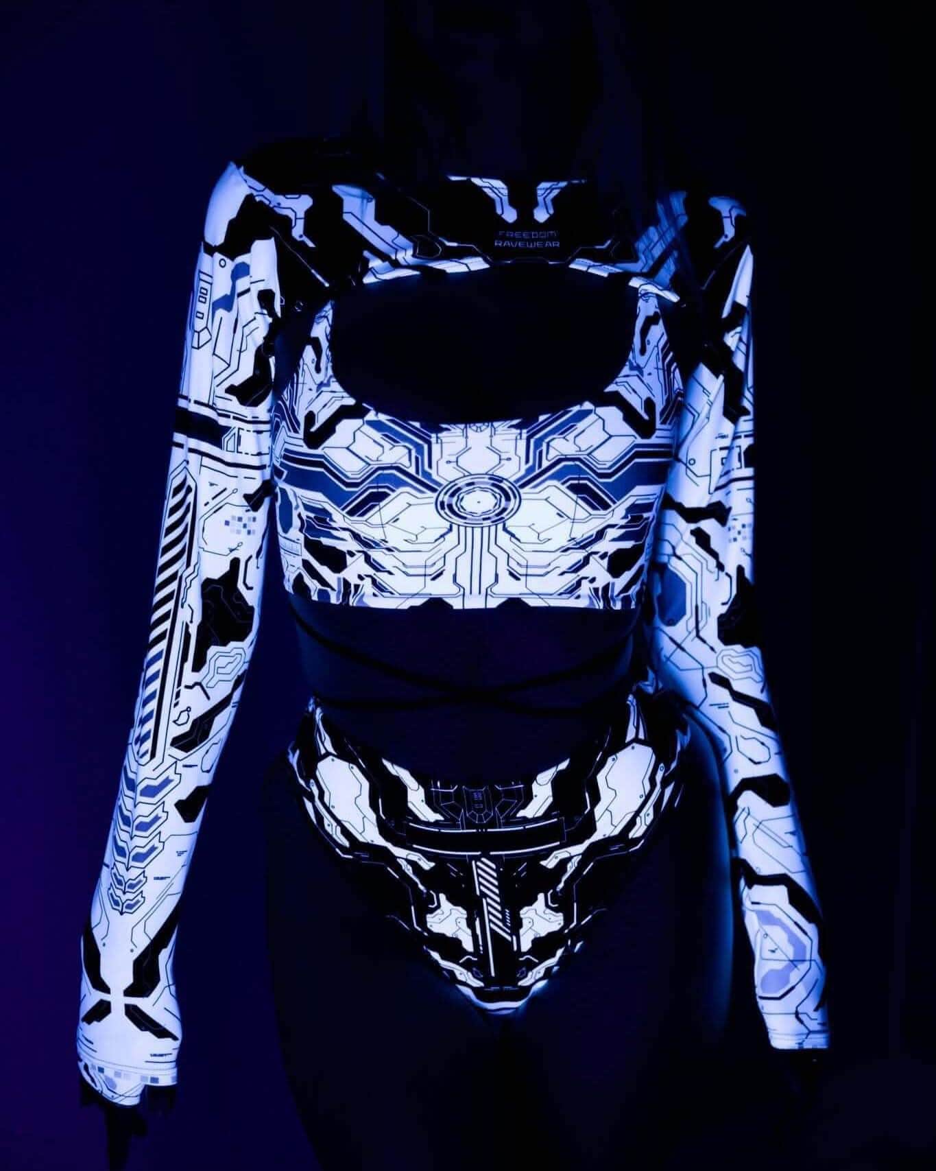 Woman wearing a neon Mechanoid rave outfit, featuring a glowing crop top and high-waisted thong, perfect for festivals.