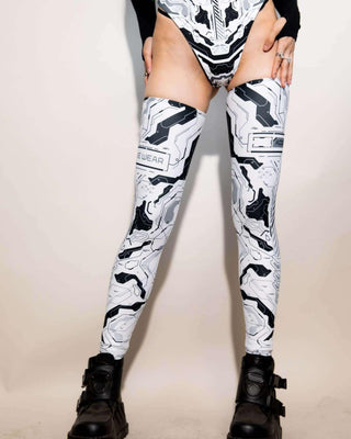 Mechanoid leg sleeves in white worn with black platform boots, perfect for rave outfits and festival style.