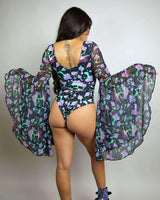 Model showcasing the Mushies Goddess Bodysuit with dramatic circle sleeves, perfect for rave outfits and stylish events.