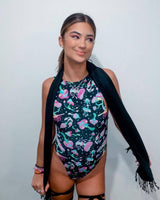 Model wearing the Mushies sideboob bodysuit with psychedelic mushroom print, perfect for rave outfits and festivals.