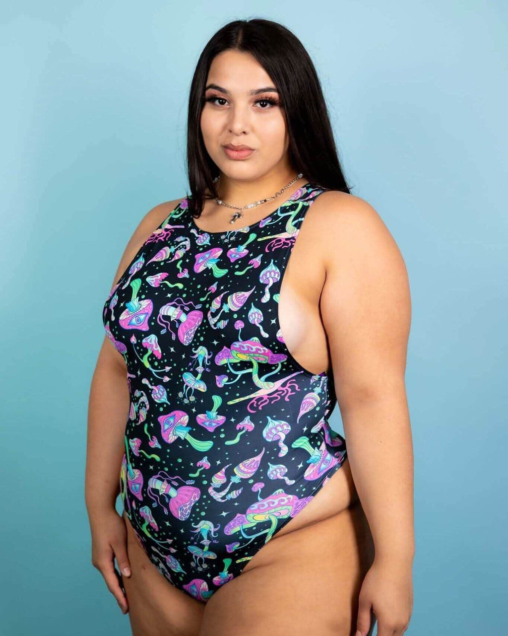 Plus size model wearing a psychedelic mushroom sideboob bodysuit, perfect for rave outfits and festivals.