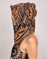 Side view of a model wearing a Primal Assassin Hood with tribal patterns, perfect for rave outfits and festivals.
