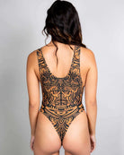Back view of a high neck Primal Sideboob Bodysuit with intricate tribal patterns, perfect for rave outfits.