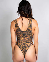 Back view of a high neck Primal Sideboob Bodysuit with intricate tribal patterns, perfect for rave outfits.